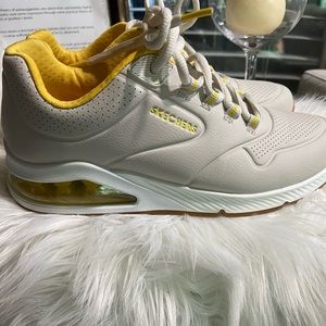Yellow,grey, and white Sketcher Street. Gently used shoes.